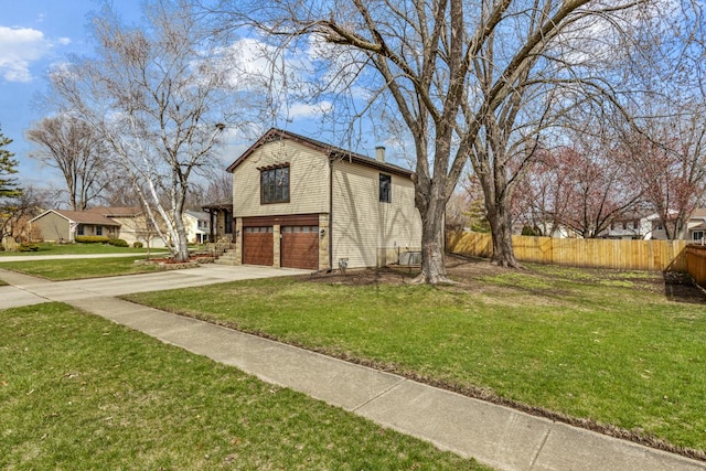 1097 Washington St, Bartlett, IL 60103 - view of home's exterior with an attached garage, driveway, and a chimney
