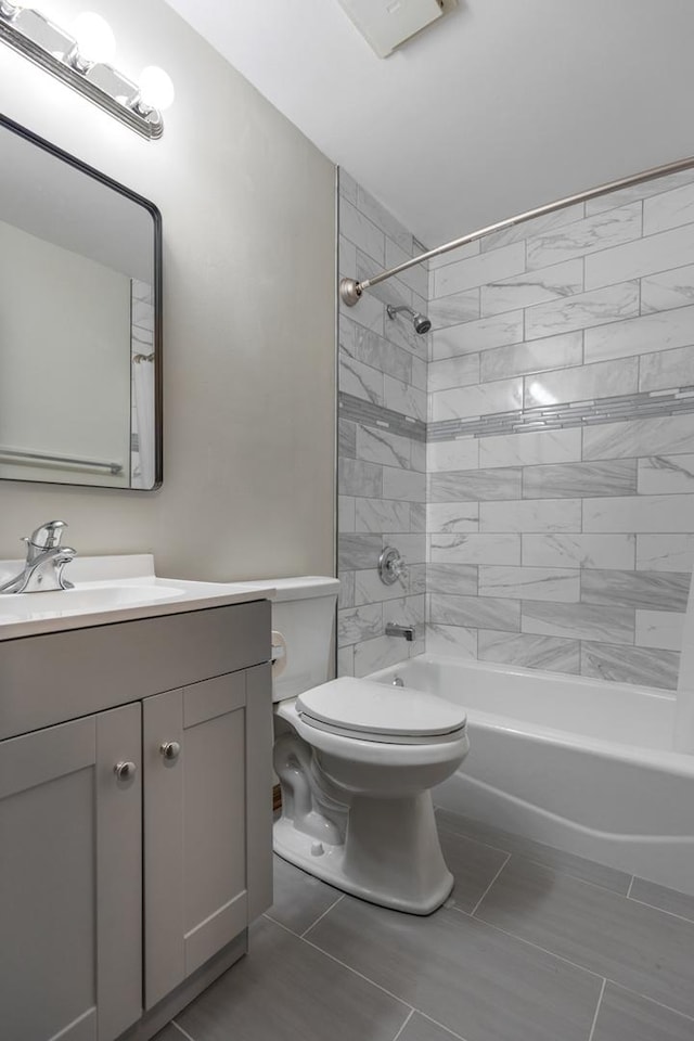 1097 Washington St, Bartlett, IL 60103 - full bath featuring toilet, vanity, washtub / shower combination, and tile patterned floors