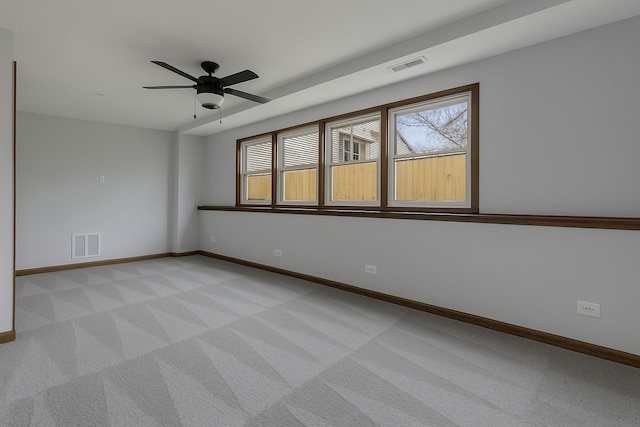 1097 Washington St, Bartlett, IL 60103 - spare room with light carpet, a ceiling fan, and baseboards