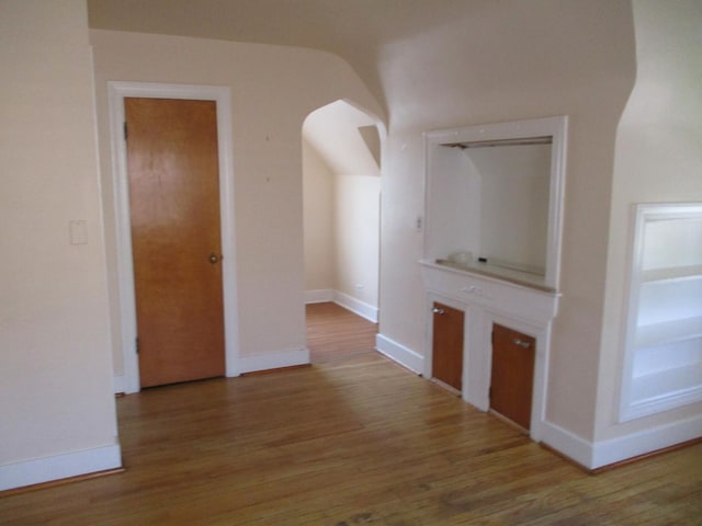 3805 Euclid Ave, Berwyn, IL 60402 - corridor featuring wood finished floors, arched walkways, and baseboards