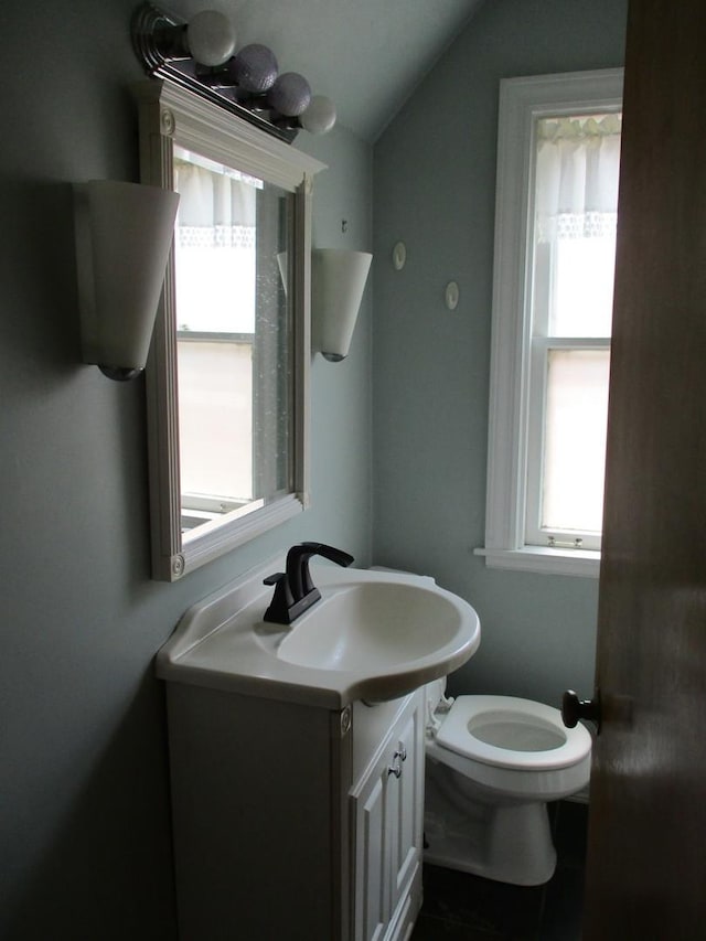 3805 Euclid Ave, Berwyn, IL 60402 - bathroom with vanity, toilet, and lofted ceiling