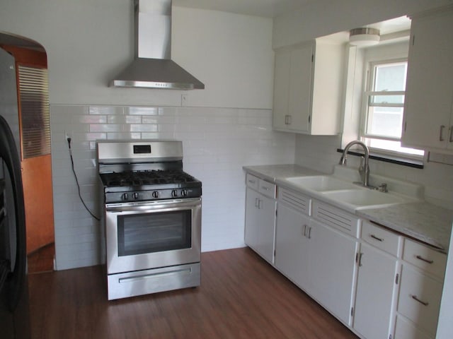 3805 Euclid Ave, Berwyn, IL 60402 - kitchen featuring stainless steel gas stove, wall chimney range hood, a sink, and dark wood-style flooring