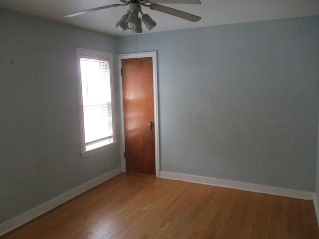 3805 Euclid Ave, Berwyn, IL 60402 - spare room with a ceiling fan, healthy amount of natural light, light wood-style flooring, and baseboards