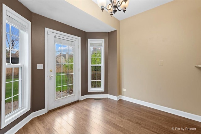 2097 Ivy Ridge Dr Unit 2097, Hoffman Estates, IL 60192 - doorway with a notable chandelier, wood finished floors, and baseboards
