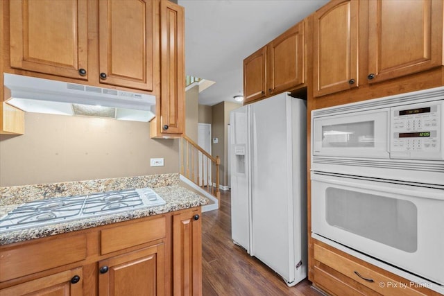 2097 Ivy Ridge Dr Unit 2097, Hoffman Estates, IL 60192 - kitchen with white appliances, light stone counters, under cabinet range hood, brown cabinets, and dark wood-style floors