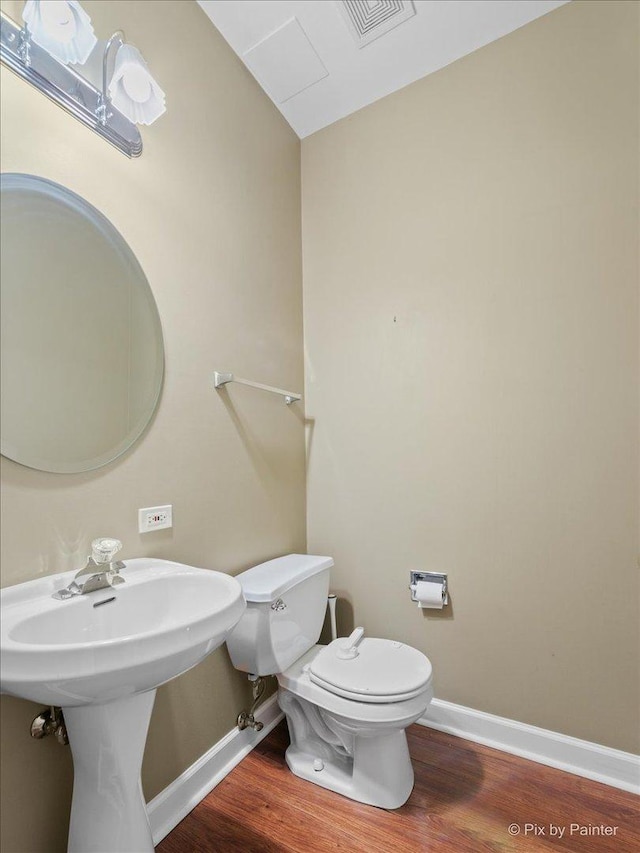 2097 Ivy Ridge Dr Unit 2097, Hoffman Estates, IL 60192 - half bathroom with toilet, visible vents, wood finished floors, and baseboards