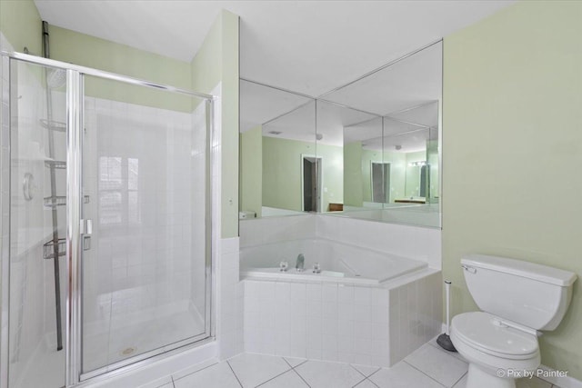 2097 Ivy Ridge Dr Unit 2097, Hoffman Estates, IL 60192 - bathroom featuring a garden tub, toilet, a shower stall, and tile patterned floors