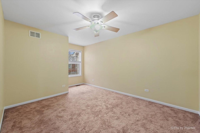 2097 Ivy Ridge Dr Unit 2097, Hoffman Estates, IL 60192 - carpeted spare room with visible vents, a ceiling fan, and baseboards