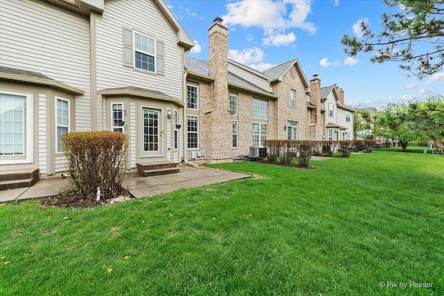 2097 Ivy Ridge Dr Unit 2097, Hoffman Estates, IL 60192 - rear view of house featuring a patio, a yard, entry steps, and a residential view