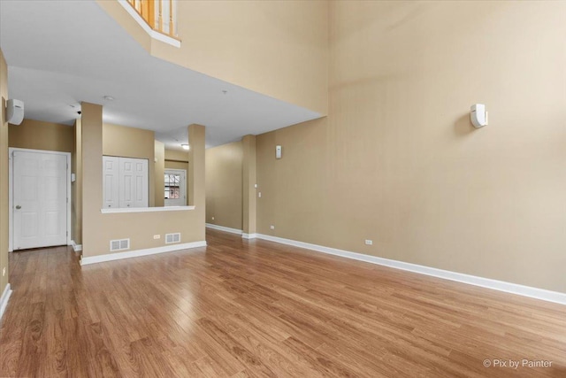 2097 Ivy Ridge Dr Unit 2097, Hoffman Estates, IL 60192 - unfurnished room with baseboards, visible vents, wood finished floors, and a high ceiling
