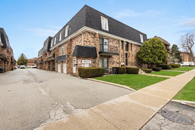 9830 Sayre Ave Unit 6, Chicago Ridge, IL 60415 - view of building exterior with an attached garage