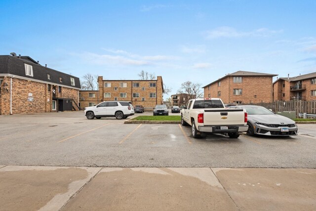 9830 Sayre Ave Unit 6, Chicago Ridge, IL 60415 - uncovered parking lot featuring fence