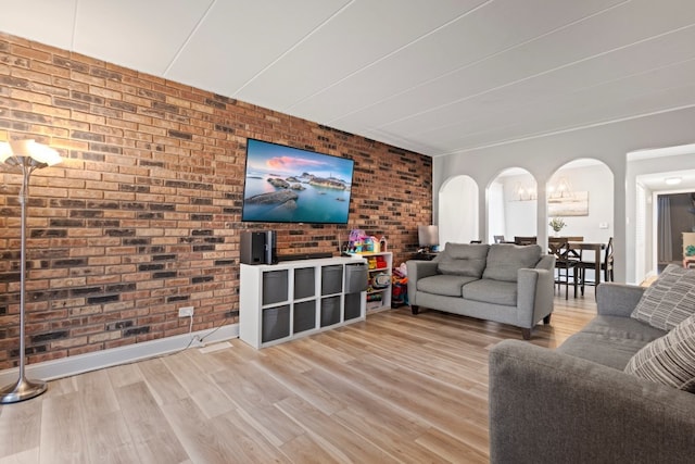 9830 Sayre Ave Unit 6, Chicago Ridge, IL 60415 - living room featuring arched walkways, baseboards, wood finished floors, and brick wall