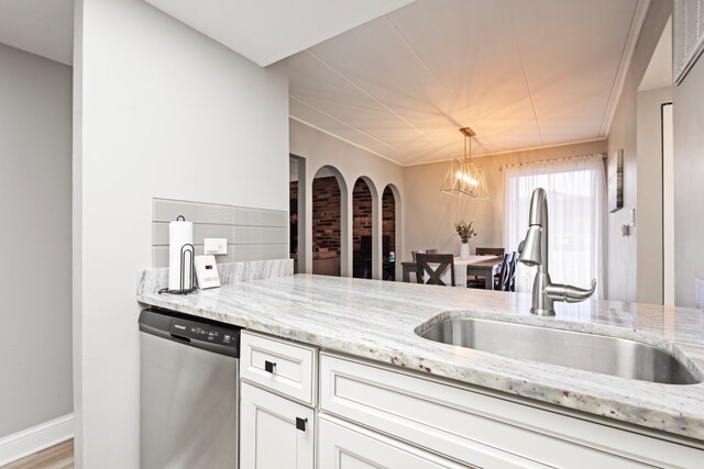9830 Sayre Ave Unit 6, Chicago Ridge, IL 60415 - kitchen with an inviting chandelier, stainless steel dishwasher, light stone counters, white cabinets, and a sink
