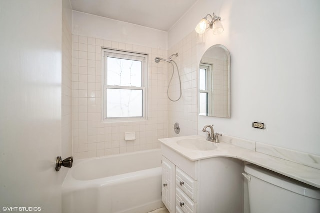 bathroom with  shower combination, vanity, and toilet