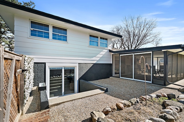 back of house with a sunroom