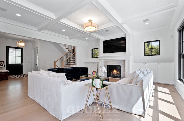 1544 Longvalley Rd, Glenview, IL 60025 - living room featuring light wood-type flooring, a wealth of natural light, stairway, and a glass covered fireplace