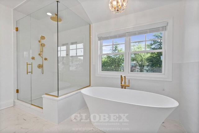 1544 Longvalley Rd, Glenview, IL 60025 - bathroom with a shower stall, a notable chandelier, a freestanding bath, and marble finish floor