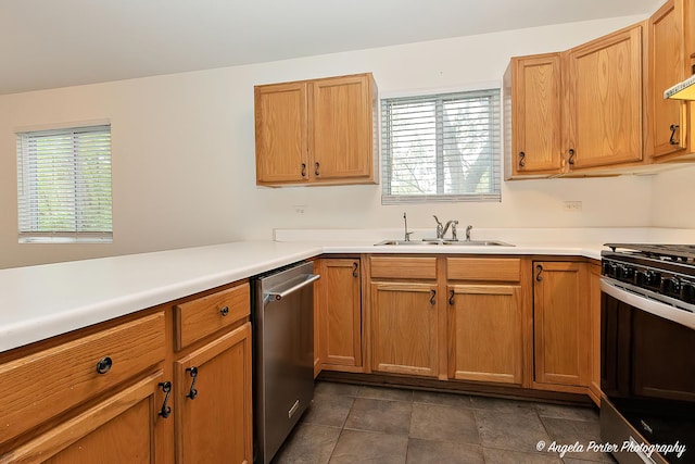 35850 N Benjamin Ave, Ingleside, IL 60041 - kitchen featuring dishwasher, range with gas stovetop, a sink, light countertops, and dark tile patterned floors