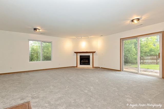 35850 N Benjamin Ave, Ingleside, IL 60041 - unfurnished living room featuring light carpet, healthy amount of natural light, and a fireplace with flush hearth