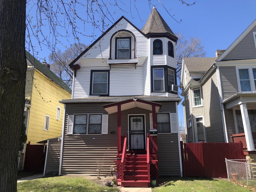 view of front of house with fence