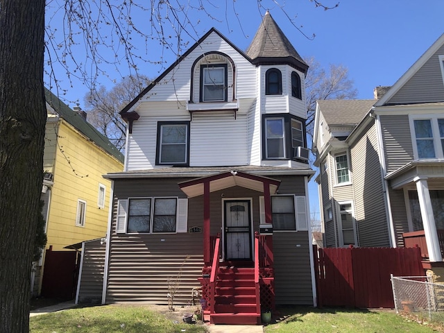 view of front of house with fence