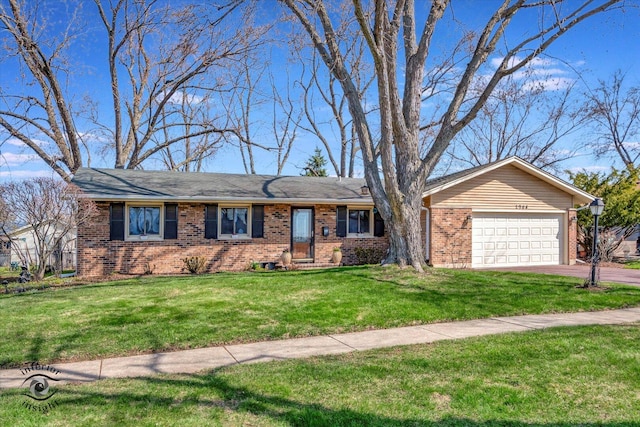 2908 71st St, Woodridge, IL 60517 - ranch-style house with aphalt driveway, an attached garage, brick siding, and a front yard