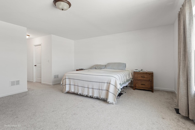 carpeted bedroom with baseboards