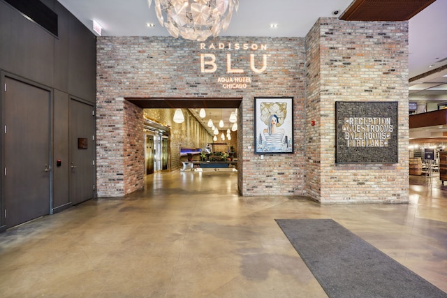 225 N Columbus Dr Unit 5305, Chicago, IL 60601 - common area featuring a high ceiling and brick wall