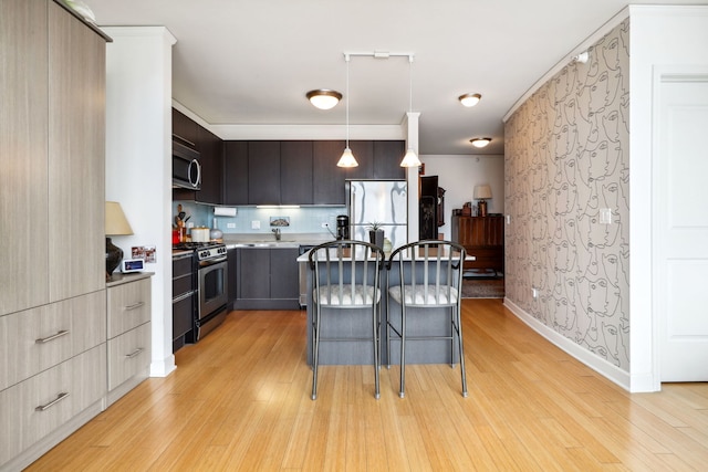 225 N Columbus Dr Unit 5305, Chicago, IL 60601 - kitchen with appliances with stainless steel finishes, light wood-type flooring, wallpapered walls, modern cabinets, and light countertops