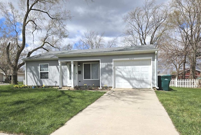 ranch-style home featuring a front yard, fence, a garage, and concrete driveway