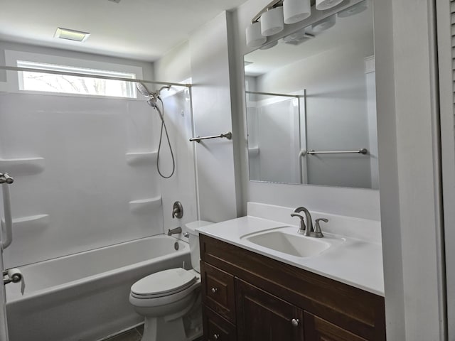 bathroom featuring bathing tub / shower combination, vanity, and toilet