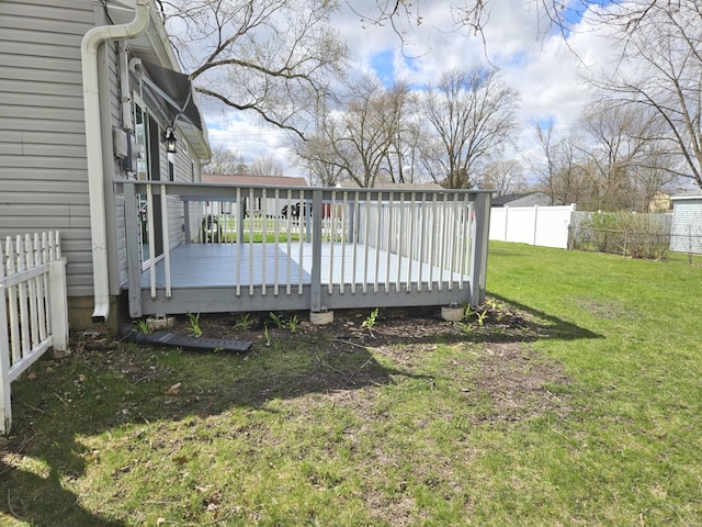 view of yard featuring fence and a wooden deck