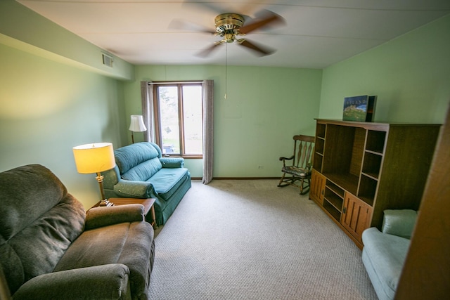 carpeted living area with visible vents, ceiling fan, and baseboards