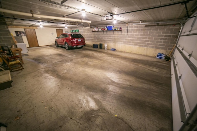 garage featuring concrete block wall