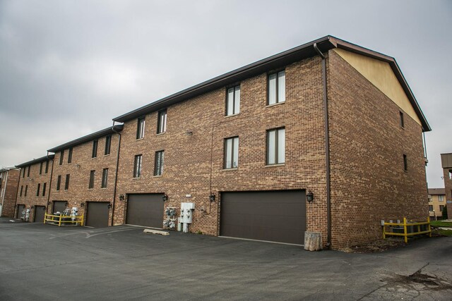 view of building exterior featuring a garage