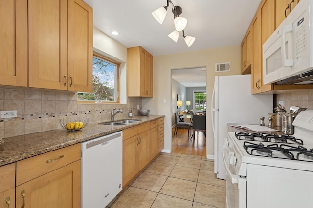 5941 N Mccook Ave, Chicago, IL 60646 - kitchen featuring white appliances, a sink, light tile patterned flooring, and healthy amount of natural light