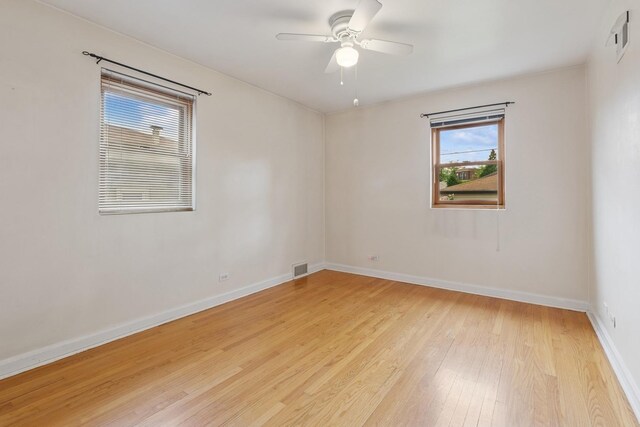 5941 N Mccook Ave, Chicago, IL 60646 - spare room featuring light wood-style flooring, baseboards, and ceiling fan
