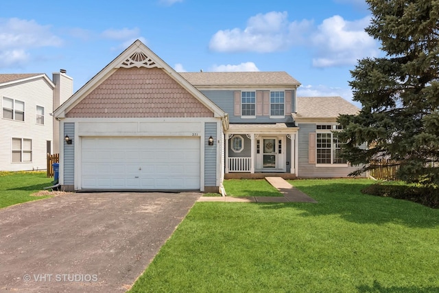 271 Valley Forge Ave, South Elgin, IL 60177 - traditional home with aphalt driveway, a front lawn, and a garage