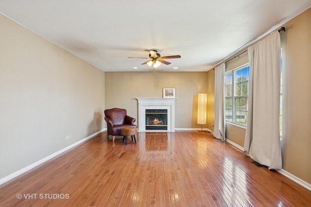 271 Valley Forge Ave, South Elgin, IL 60177 - living area with a fireplace with flush hearth, light wood-style floors, a ceiling fan, visible vents, and baseboards