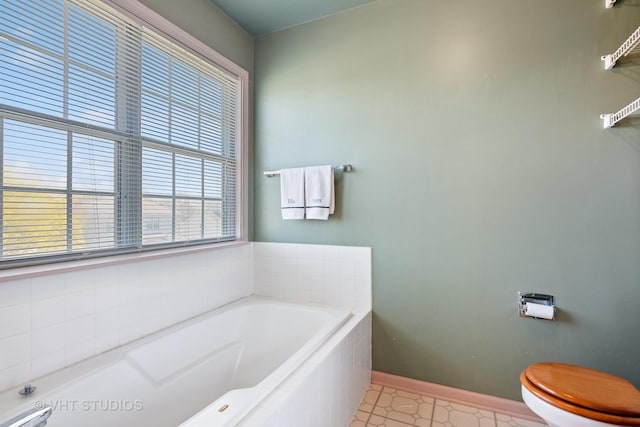 271 Valley Forge Ave, South Elgin, IL 60177 - bathroom with baseboards, toilet, and a garden tub
