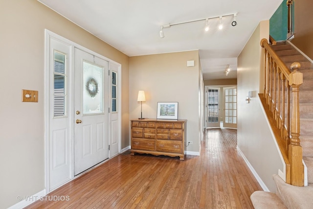 271 Valley Forge Ave, South Elgin, IL 60177 - foyer featuring hardwood / wood-style floors, rail lighting, stairway, and baseboards