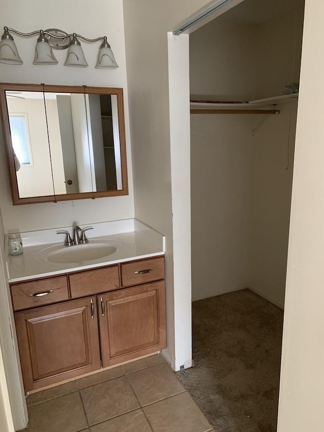 bathroom featuring tile patterned floors and vanity