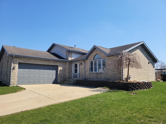310 E Butler Ave, Grant Park, IL 60940 - ranch-style house with brick siding, driveway, a garage, and a front lawn