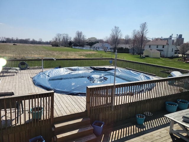310 E Butler Ave, Grant Park, IL 60940 - view of swimming pool with a yard, a deck, and a fenced in pool