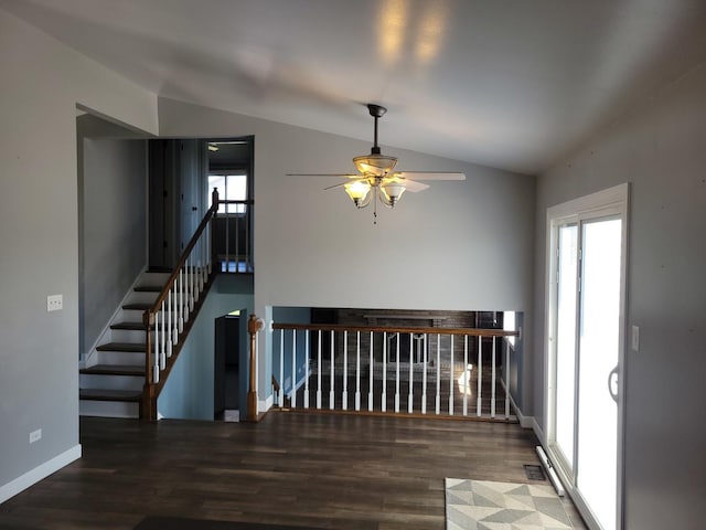 310 E Butler Ave, Grant Park, IL 60940 - unfurnished room with a ceiling fan, wood finished floors, vaulted ceiling, and a healthy amount of sunlight