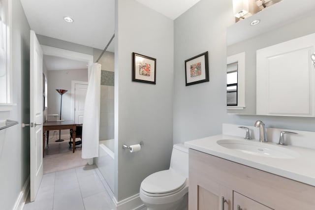 bathroom featuring vanity, baseboards, tile patterned flooring, shower / bath combination with curtain, and toilet