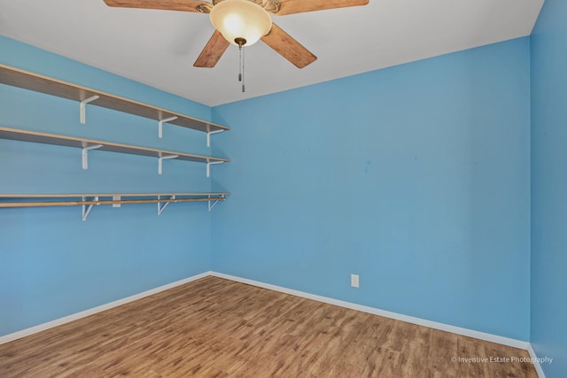 308 Eaton Ave, Romeoville, IL 60446 - spare room featuring baseboards, a ceiling fan, and wood finished floors