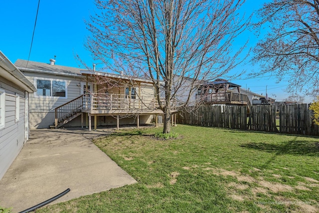 308 Eaton Ave, Romeoville, IL 60446 - view of yard with a wooden deck and fence