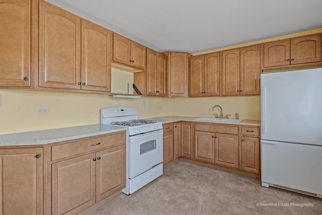 308 Eaton Ave, Romeoville, IL 60446 - kitchen with a sink, light countertops, and white appliances